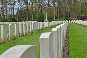 Fototapeta na wymiar Rows of white marble headstones stand in memory of the men lost in battle during WW II at Oosterbeek war cemetery, Arnhem, Netherlands.