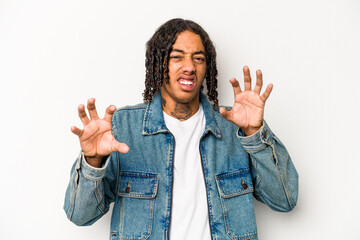 Young African American man isolated on white background showing claws imitating a cat, aggressive gesture.