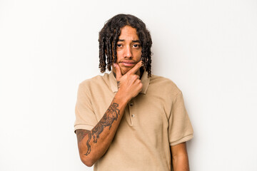 Young African American man isolated on white background contemplating, planning a strategy, thinking about the way of a business.