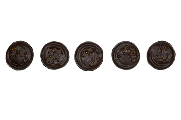 A row of cookies covered with chocolate and nuts, isolated on a white background - Powered by Adobe
