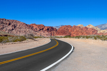 Fototapeta na wymiar A curved road in the Red Rock Canyon National Conservation Area in Nevada