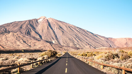 Asphalt road to Teide National Park in Tenerife - Canarian world famous volcano - Wander concept with world nature wonder on unique wild landscape in Canary Islands