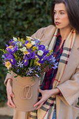 Bouquet of spring flowers:irises, lisianthus in a hatbox birthday present, Mother's Day, Women's Day