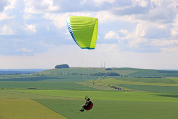 Paraglider flying in the Pewsey Vale, Wiltshire