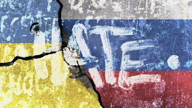 Ukrainian and russian flag painted on concrete wall with the text hate on top. war and conflict concept between russia, nato and ukraine 2022.