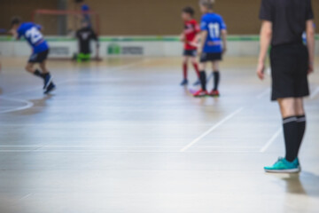 View of floorball match game, court hall indoor venue with junior teenage children school team...