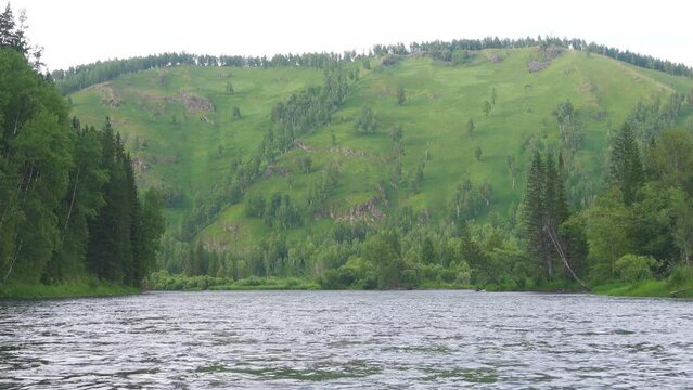 Middle Siberia, Krasnoyarsk Territory. Hilly (coniform hill) river bank, pour. Taiga mixed forests, fores meadows