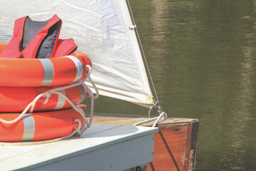 Red Life Jackets and Orange Lifebuoys, Personal Life-saving Appliances at Boat Pier