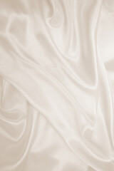 Obraz premium Smooth elegant golden silk or satin luxury cloth texture as wedding background. Luxurious background design. In Sepia toned. Retro style