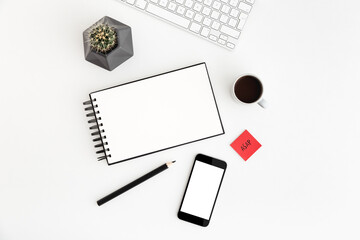 White table with notebook, coffee, cactus and smartphone screen for mock up or product montage. Flat lay.