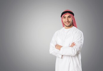 Young handsome Emirati business man in traditional outfit. Arabic ambitious mature businessman.