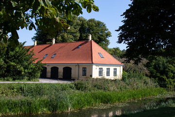 Colorful old historic country house in Denmark. Traditional Scandinavian houses.