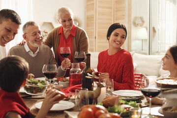 Happy family enjoying festive dinner at home. Christmas celebration
