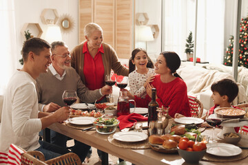 Happy family enjoying festive dinner at home. Christmas celebration