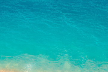 Fototapeta na wymiar Turquoise sea background photo. Abstract background of calm sea