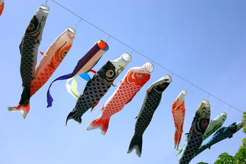 A blue clear sky and a Koi fish streamer swaying in the wind