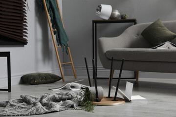 Chaotic living room interior after strong earthquake