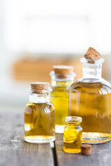 Assortment of organic essential oils. Natural moisturizing body and face treatment. Plant extract for healthy young skin. Relaxation, aromatherapy, salon spa. Close up, macro view