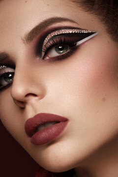 Portrait of a beautiful woman in a disco style image with creative makeup and hairstyle.