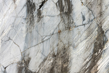 Marble surface with veins and a beautiful pattern on an industrial quarry. Karelia. Russia