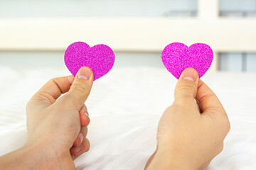 Hearts in hands on a white background. Congratulations on Valentine's Day.