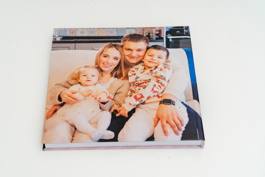 cover of a book with photos of big family at home on a white background.