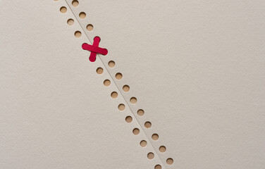 paper, holes, thread, and blank space