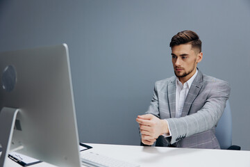 handsome man documents on the table computer work emotions technologies