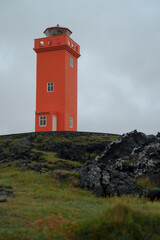 Svortuloft red lighthouse on the cliff near the ocean in Western Iceland. Snaefellsnes (Snæfellsnes) peninsula