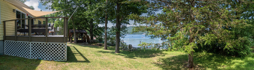 Panoramic view of the backyard of a cottage at Lake Champlain