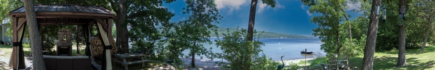 Panoramic view of the backyard of a cottage at Lake Champlain