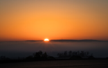 sunrise over fog