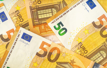 Close up of 50 euro cash banknotes. European money background for financial and economy topics.