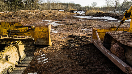Heavy machinery in the mud and snow