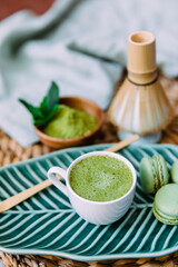 Matcha tea drink. Green matcha powder and bamboo whisk for making matcha tea. The concept of the Japanese tea ceremony.