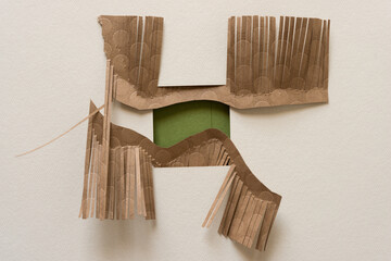 paper frame, green square, and cut brown paper (fringe)
