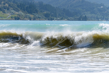 Beautiful blue sea and sky beyond white water from crashing and tumbling surf