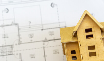 Creative flat lay  top view blueprints architectural flat project plan and home model on decorator white table workspace equipment background copy space concept