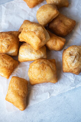 Top view of Baursak, Kazakh traditional baking, pieces of dough deep fried in oil.
