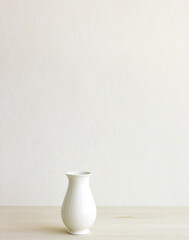 Fototapeta na wymiar White Vase Cream Wall