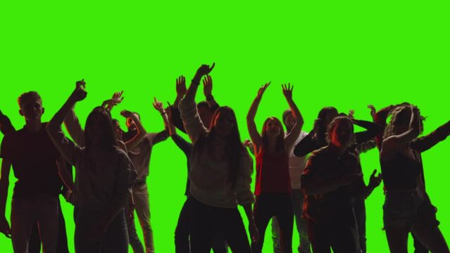 A crowd of fiends is jumping and dancing together at disco club in slow-motion on greenscreen