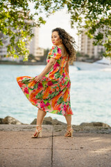 Beautiful adult model flipping her dress in the wind