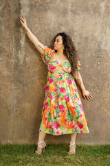 Woman posing on a concrete wall