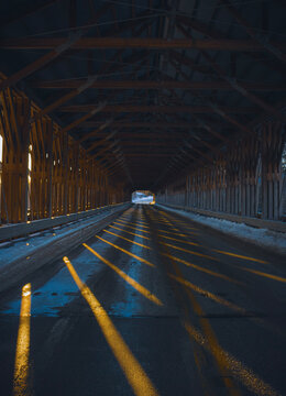 A photo inside of the Smolen-Gulf Covered Bridge at dusk in Ashtabula, Ohio