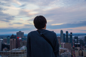 Fototapeta na wymiar Asian man looking down Montreal