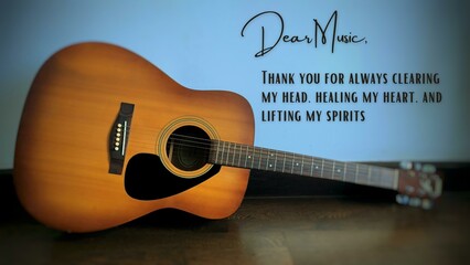 Close up of motivational and inspirational quotes with blurred guitar background. Motivational and music concept