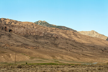 A road leads to a cave in the mountain near Birch Creek Campground in Idaho, USA