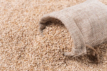 close up of sesame seeds in sack background
