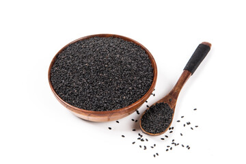 black sesame seeds  in wooden plate isolated on white background