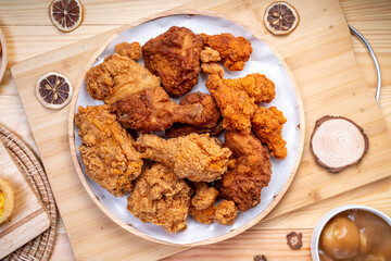 Fried chicken in woode plate on wooden background, Fried chicken on wooden background.